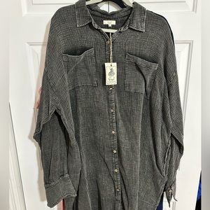 Super cute linen material dress. More of a charcoal color. Never worn.